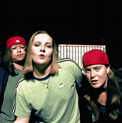 Woman In Green Shirt And Red Hat With Letter C GIF