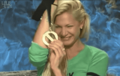 Woman In Green Shirt Holding Medal GIF