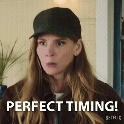 Woman In Green Shirt Making Clumsy Sign GIF