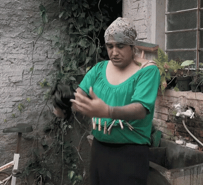 Woman In Green Shirt Saying A GIF