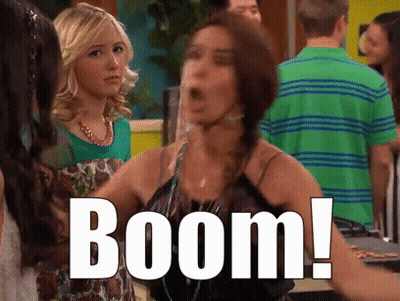 Woman In Green Shirt Says Boom GIF