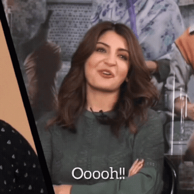Woman In Green Shirt Smiling Oooh GIF