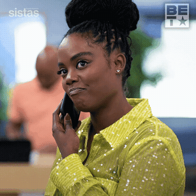 Woman In Green Shirt Talking On Phone GIF