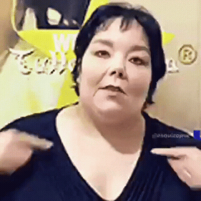 Woman In Green Shirt Talking On Phone While Man Looks On GIF