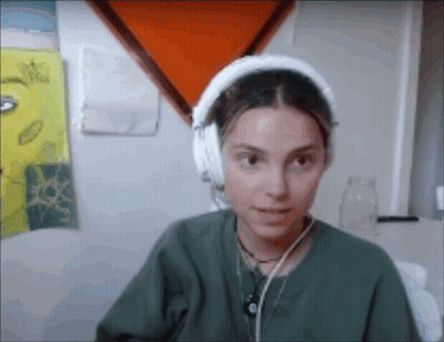 Woman In Green Shirt With Headphones GIF