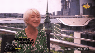 Woman In Green Shirt With Hobbs & Shaw Hawaii GIF