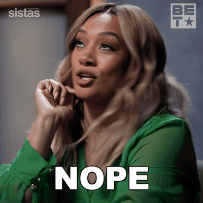 Woman In Green Shirt With Nope On Face GIF