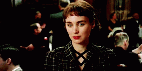 Woman In Green Suit And Red Lipstick Smiling GIF
