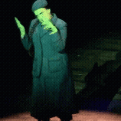 Woman In Green Suit Dancing On Stage GIF