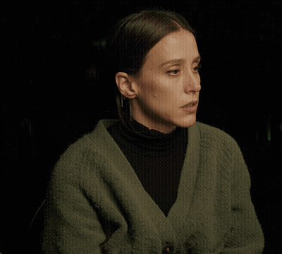 Woman In Green Sweater And Black Turtleneck GIF