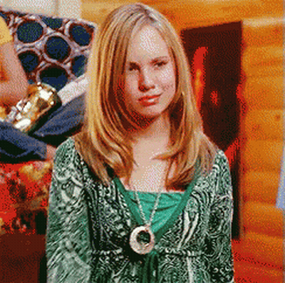 Woman In Green Sweater And Circle Necklace GIF