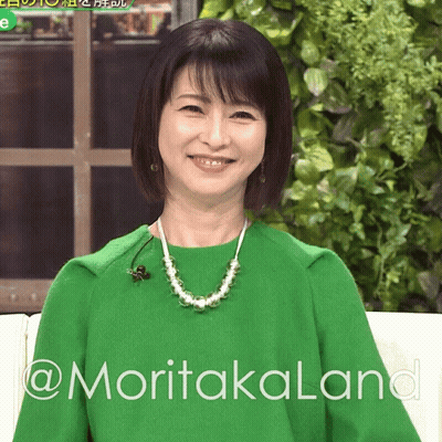 Woman In Green Sweater And Pearls On Couch @Moritakalana GIF