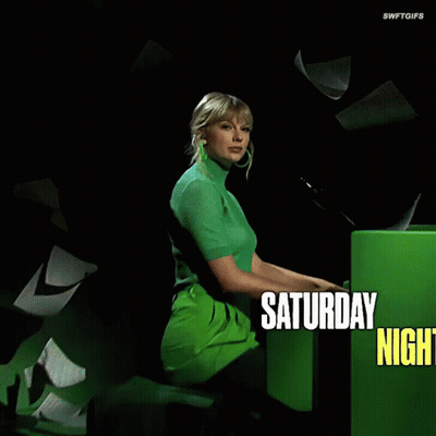 Woman In Green Sweater At Microphone Saturday Night Live GIF