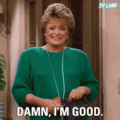 Woman In Green Sweater Holding Purse Saying Damn I'm Good GIF