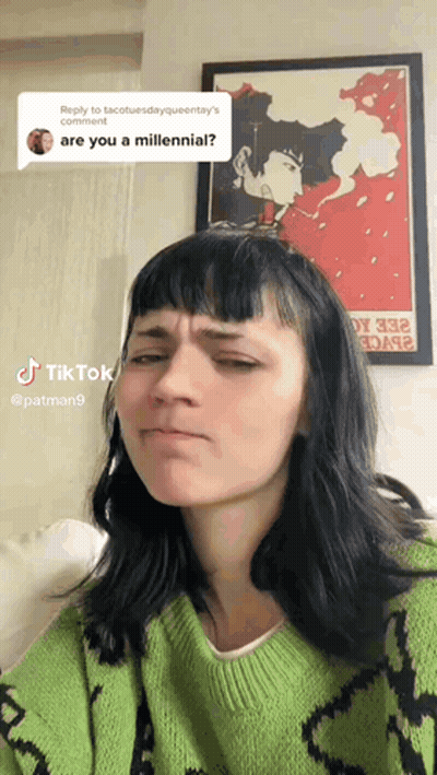 Woman In Green Sweater Making Funny Face GIF