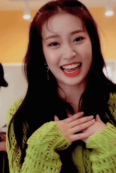Woman In Green Sweater Smiling With Red Lipstick GIF
