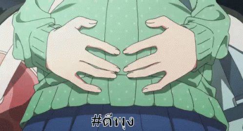 Woman In Green Sweater With Hands On Stomach GIF