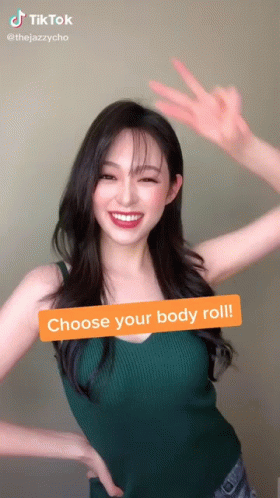 Woman In Green Tank Top Making Peace Sign GIF