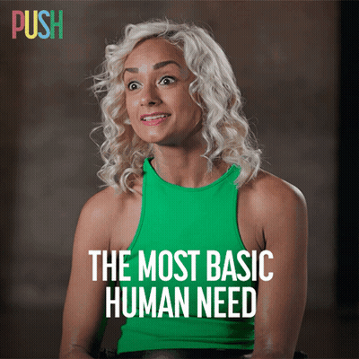 Woman In Green Tank Top Saying The Most Basic Human Need GIF