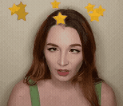 Woman In Green Tank Top With Three Yellow Stars On Head GIF
