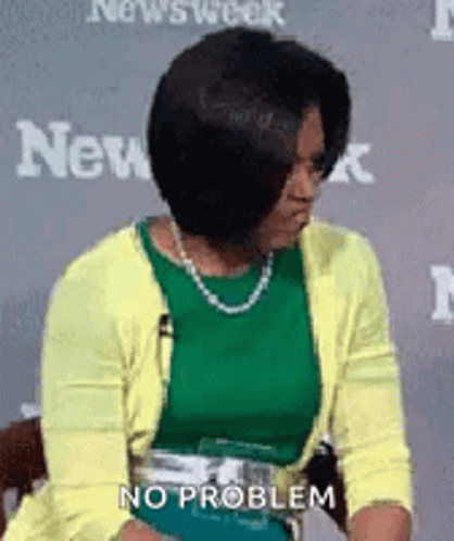 Woman In Green Top And Yellow Cardigan GIF