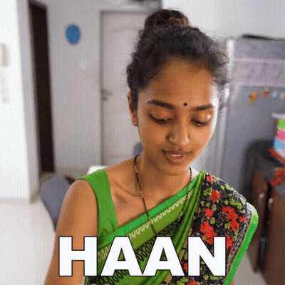 Woman In Green Top Saying Haan GIF