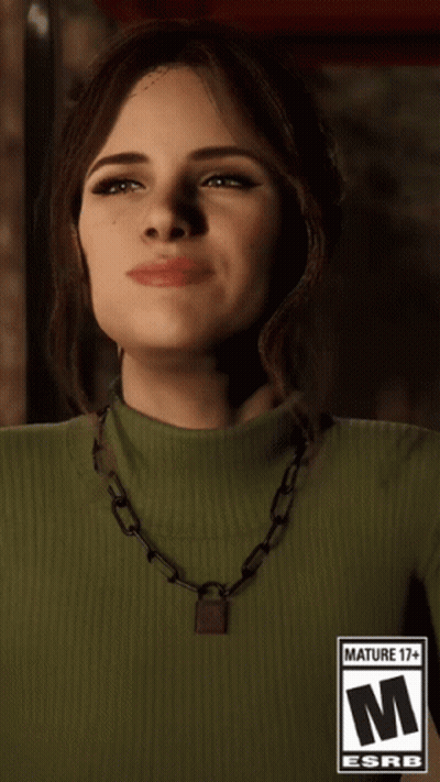 Woman In Green Turtleneck With 17+ Label Necklace GIF