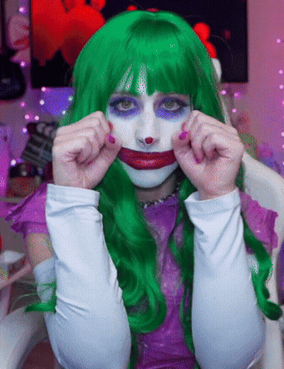 Woman In Green Wig And White Gloves Joker GIF
