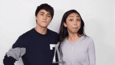 Woman In Grey Maryland Sweater With Man GIF