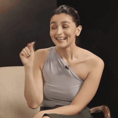 Woman In Grey One-Shoulder Top Making Funny Face GIF