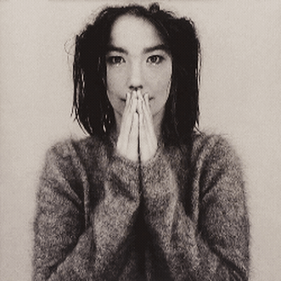 Woman In Grey Sweater Covering Mouth GIF