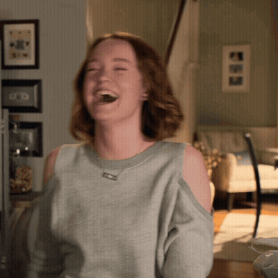 Woman In Grey Sweater Laughing GIF