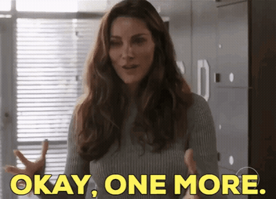 Woman In Grey Sweater Saying Okay GIF