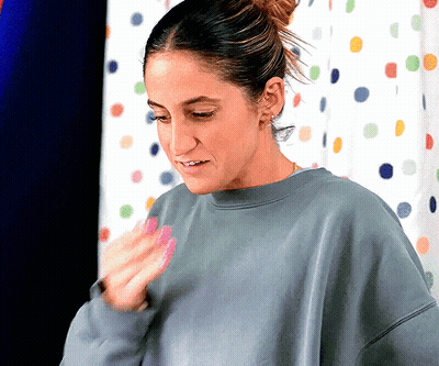 Woman In Grey Sweatshirt By Polka Dot Curtain GIF