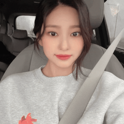 Woman In Grey Sweatshirt In Car GIF