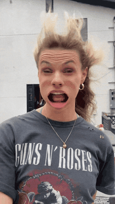 Woman In Guns N Roses T-Shirt Making Funny Face GIF