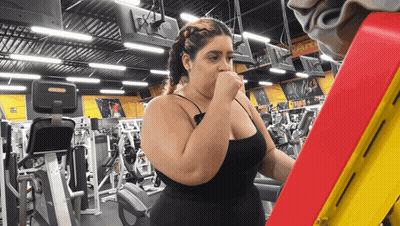 Woman In Gym With A & S Sign GIF