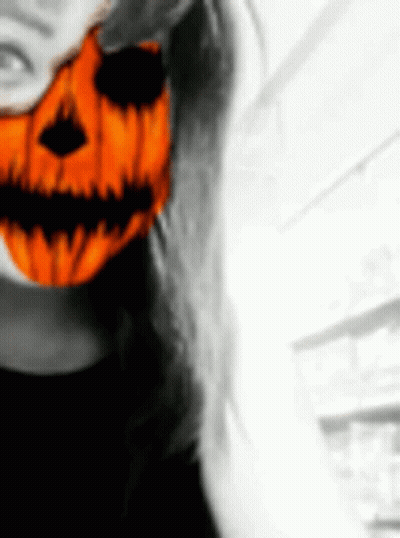 Woman In Halloween Mask With Pumpkin Face GIF
