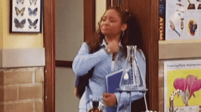 Woman In Hallway With Beaker And Book GIF