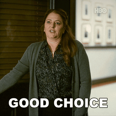 Woman In Hallway With Good Choice Sign GIF