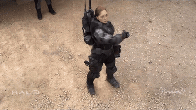 Woman In Halo Costume Standing On Gravel GIF