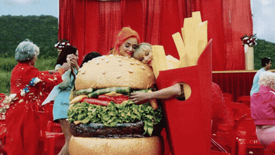 Woman In Hamburger Costume Hugging Woman In Fries Costume GIF