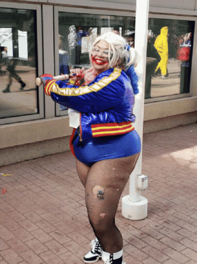 Woman in Harley Quinn Costume Holding Baseball Bat
