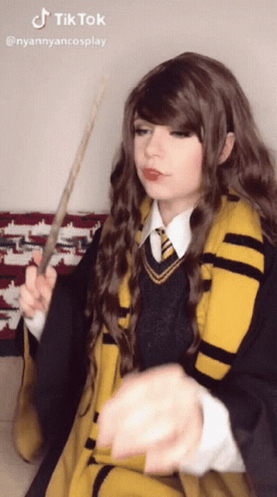 Woman In Harry Potter Costume Holding Wand And TikTok Sticker GIF