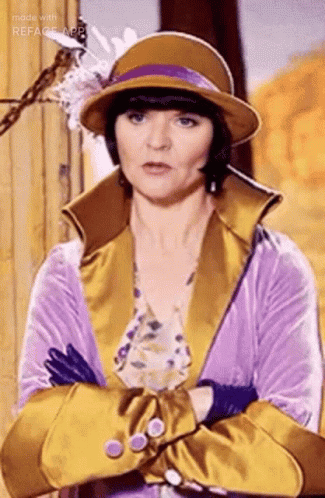 Woman In Hat And Gloves Standing With Arms Crossed GIF