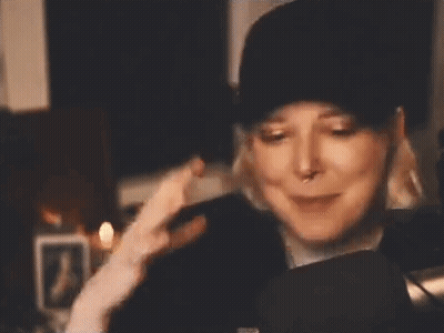 Woman In Hat And Headphones Making Funny Face GIF