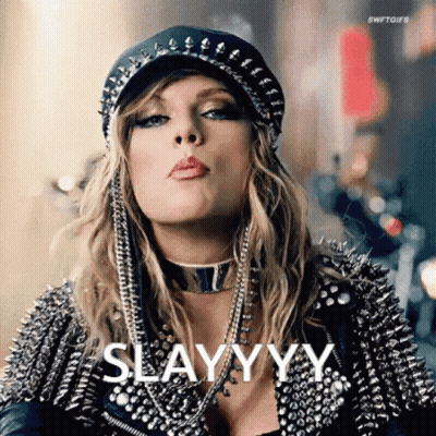 Woman In Hat And Leather Jacket Blowing A Kiss Saying Slayyyy GIF