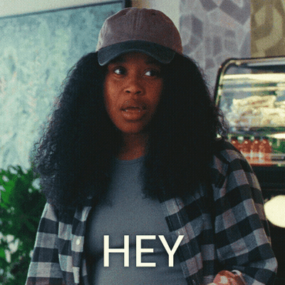 Woman In Hat And Plaid Shirt Saying Hey GIF
