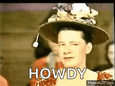 Woman In Hat And Red Dress Standing Before Crowd GIF