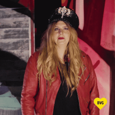 Woman In Hat And Red Jacket With Yellow Heart Saying BG GIF